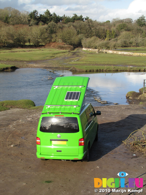 SX12396 Our green VW T5 campervan with popup roof up at Ogmore Castle